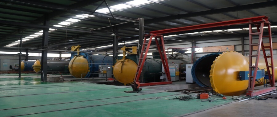 Industrial autoclave oven for manufacturing void-free carbon fiber sheets.