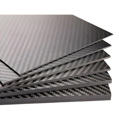 Stack of Toray T700 carbon fiber plates in various thicknesses (0.5mm to 10mm).